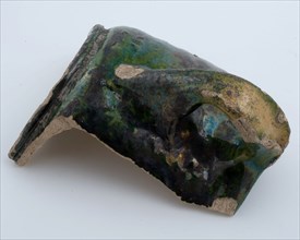 Fragment of earthenware head, green and yellow glazed, cup beaker crockery holder soil find ceramic earthenware glaze lead glaze