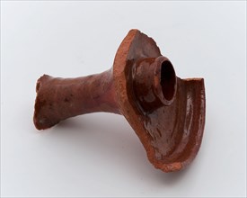 Fragment of candle holder of red earthenware, raised edge, candleholder lighting medium fragment earthenware pottery earthenware