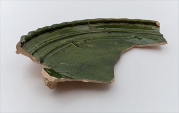 Fragment of dish on stand lobes, green, rippled edge, dish kitchenware holder soil find ceramic earthenware glaze tin glaze