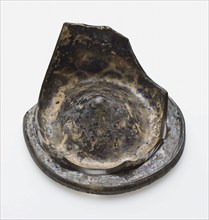 Fragment of soil, part of stand ring and wall of smooth drinking cup, drinking cup drinking utensils holder soil find glass