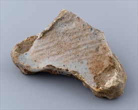 Fragment of prune, soil find ceramic earthenware glaze lead glaze, baked Triangular flat object with points on the three corners