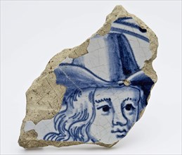 Fragment of majolica dish with image of man with hat in blue, plate crockery holder soil find ceramic earthenware glaze tin