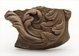 Fragment of terracotta ornament, decorated with acanthus leaves in relief, ornament soil find ceramic terracotta, baked