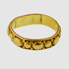Golden ring, exterior decorated with rosettes and studs, marked, ring ornament clothing accessory clothing soil find gold metal