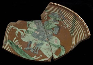Fragment Werra plate, mirror ornament nobleman on horseback, year 1621, pale yellow, green and blue glaze, plate crockery holder