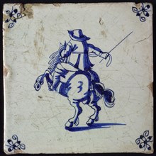 Figure tile with blue rider with whip in hand; corner motif spider, wall tile tile sculpture ceramic earthenware glaze, baked 2x