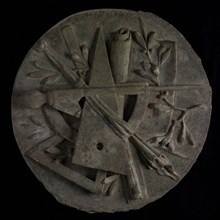 Round plaque with carved masonic symbols: compass, square, triangle and branches with leaves, plaque ornament fragment building