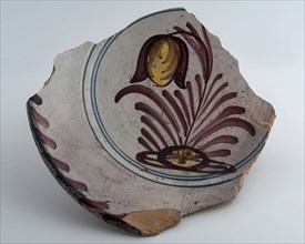 Fragment of dish, yellow shard, polychrome decorated, depicting flowering plant, dish crockery holder soil find ceramic