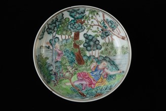 Dish of cup and saucer with lying woman and man in landscape in bushes, cup and saucer drinking utensils tableware holder