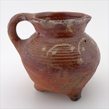 Pottery cooking jug, grape model, decorated in sludge technology, on three legs, cooking jug be found in the earthenware ceramic
