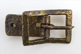 Buckle of shoe or belt, rectangularly bent with fitting lip, clasp fastener component soil found brass metal, archeology