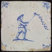 Scene tile, child's play, boy with kite, corner motif ox's head, wall tile tile sculpture ceramic earthenware glaze tin glaze