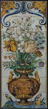Polychrome tile picture, decorated flower vase, above two birds, down bird at bunch of grapes and pomegranate, tile picture