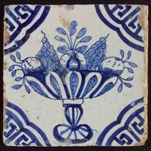 White tile with blue fruit bowl on stand, apples and grapes; corner pattern meander angle, wall tile tile sculpture ceramics