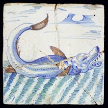 Scene tile, in green, brown and blue on white, large fish or dolphin, to the right in continuous water, wall tile tile sculpture