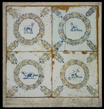 Tile field, four tiles, blue, yellow and brown on white, with goat In aigrettekrans and three times dog in aigrettekrans, corner
