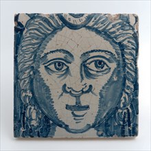 Tile of chimney pilaster, blue on white, head of woman with long curly hair, chimney pilaster tile pilaster footage fragment