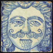 Tile of chimney pillaster, blue on white, head of man with long curly hair, curly mustache and pointed beard, chimney pilaster