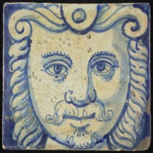 Tile of chimney pilaster, blue on white, head of man with long curly hair, curly mustache and beard, chimney pilaster tile