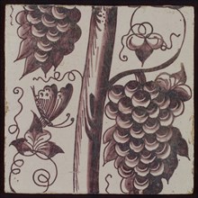 Tile of purple pilaster with tree trunk with curled twigs, leaves, bunches of grapes and surrounded by butterflies, tile
