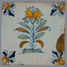 Flower Tile, flower on ground in orange, yellow, brown green and blue on white, corner pattern French lily, corner point orange