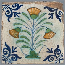 Flower Tile, flower on ground in orange, green and blue on white, corner motif oxen head, wall tile tile sculpture ceramic