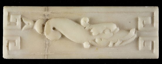 White marble relief, dolphin, with two curls in tail, meander-ornament in corners, relief marble stone, Rotterdam City Triangle