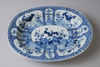 Oval porcelain dish with depiction in blue, dish saucer tableware holder ceramic porcelain glaze, baked painted glazed oval deep
