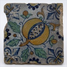 Tile with polychrome pomegranate, fleur de lis as corner decoration, tile sculpture wall tile soil find ceramic earthenware