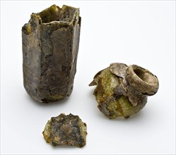 Small hexagonal bottle in three fragments, extremely weathered, bottle holder bottomfound glass, blow molded Fragments of small