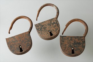 Three similar padlocks with matching keys, which belong to the storage handles of the oak coffin, padlock lock closing device