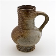 Small stoneware jug on standing surface, stocky belly and cylindrical neck with rings, jug holder soil find ceramic stoneware