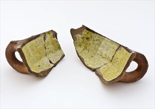 Fragments of dish with standing ear, decorated with serrated ridge, internally glazed, porcelain crockery holder soil find