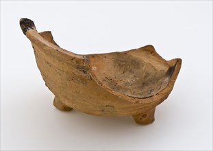 Fragment of unglazed test on three legs, side wall with revolving blades, test fire-proof stool soil find ceramic pottery, hand