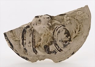 Fragment of pipe seal or tablet, on which embossed, Bacchus on the barrel, seal soil found ceramic pipe earth, baked in form