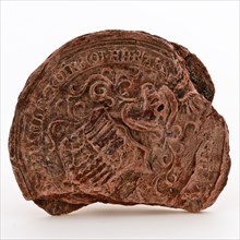 Fragment of wax seal with family coat of arms and lettering, soft red, wax seal seal information form ground find lacquer was