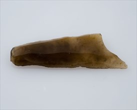 Flint point of yellowish, translucent flint, point artifact soil finding flint, mined Small point of flint from the stone age