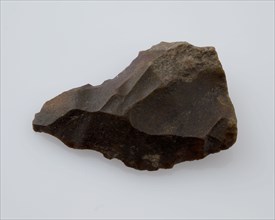 Flint point, or flare of brown flint, point artifact founding flint, mined Small point of flint from the stone age or bronze age