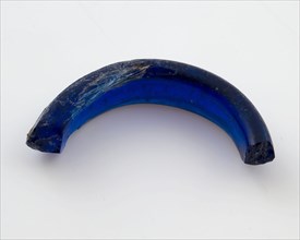Fragment of glass pendant or ring, dark blue glass, jewelery clothing accessory clothing soil find glass, molten drawn