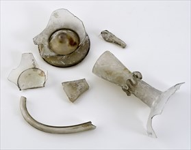 Fragments of foot, bottom, body, neck, spout and handle of spout jar, carafe holder fragment soil finds glass, free blown