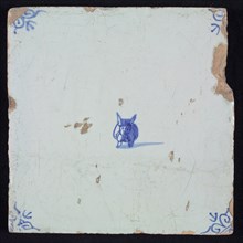 Figure tile with strange creature, blue decor on white ground, corner filler ox head, wall tile tile sculpture ceramic