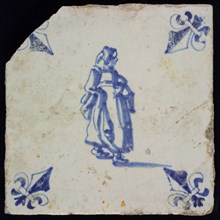 AC, Figure tile, woman with basket on arm, blue decor on white ground, corner filling lily, marked, wall tile tile sculpture