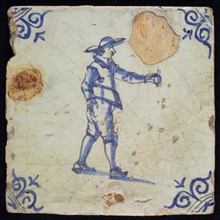 CA, Figure tile, man with egg? in his hand, blue decor on white ground, corner fill: ox's head, marked, wall tile tile sculpture