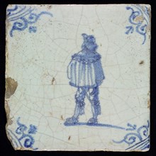GA (?), Figure tile, man with short coat, blue decor on white ground, corner fill: ox head, marked, wall tile tile sculpture