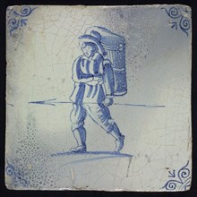 QJ, Figure tile, man with basket and spear, blue decor on white ground, corner fill: ox head, marked, wall tile tile sculpture