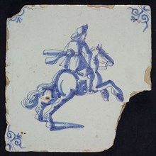 IK, Figure tile, rider on rearing horse, blue decor on white ground, corner filling: ox head, marked, wall tile tile sculpture