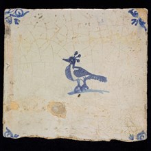 Animal tile with bird, three plumes on the head, blue decor on white ground, corner fill: ox head, marked, wall tile tile image