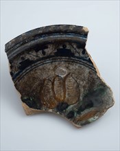 Fragment of majolica dish, polychrome three-tier or flower vase in the mirror, plate crockery holder soil find ceramic