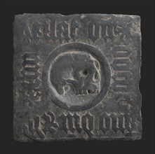 Square headstone with gothic text and skull, tombstone shale stone, carved minced Square tombstone with gothic text around skull