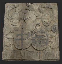 Facing brick with arms of the cheese buyer Adriaen Groenhout and Ermgaard Beaumont and caption Groenhout 1648, gable sculpture